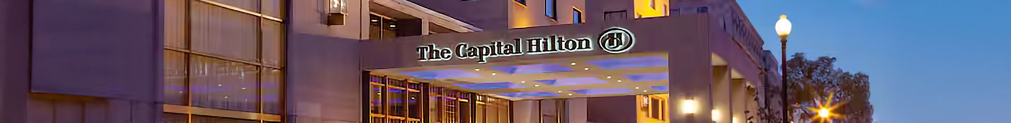 The Capital Hilton exterior at night