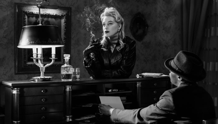 Noir black and white setting of a woman smoking
